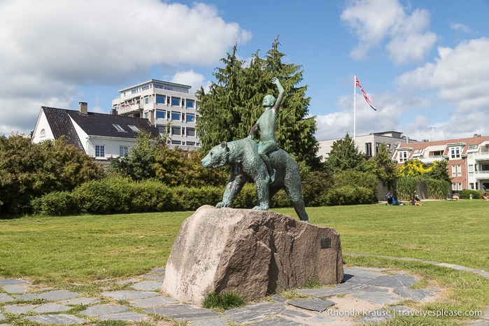 Statue of a boy riding a bear in Kristiansand.