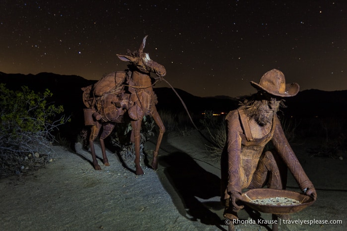 Gold miner sculpture at night- Borrego Springs, California travelyesplease.com | Borrego Springs Sculptures- The Metal Sky Art Sculptures of Ricardo Breceda