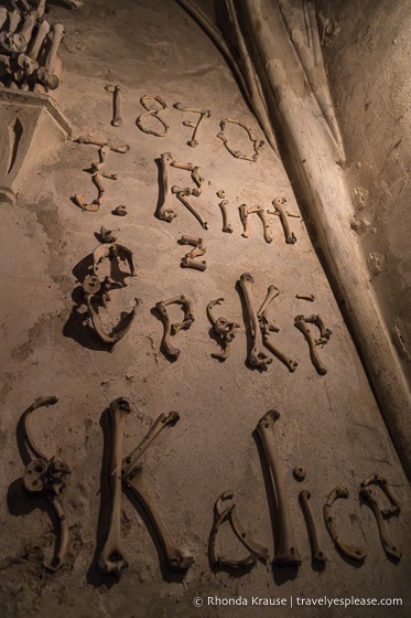 Frantisek Rint leaves his signature in bones inside Sedlec Ossuary.